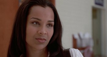 Movie still from “The Players Club” (1998), directed by Ice Cube – A person with long black hair; Close Up shot, Over the shoulder angle