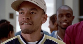 Movie still from “The Players Club” (1998), directed by Ice Cube – A person wearing a hat; Close Up shot, Low angle