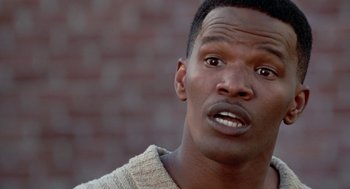 Movie still from “The Players Club” (1998), directed by Ice Cube – A person with his mouth wide open; Close Up shot, Low angle