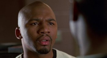 Movie still from “The Players Club” (1998), directed by Ice Cube – A person with a beard; Close Up shot, Low angle