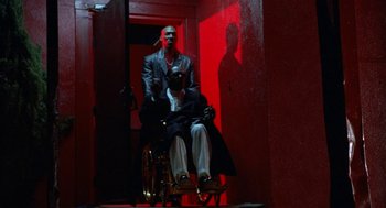 Movie still from “The Players Club” (1998), directed by Ice Cube – A man in a wheel chair and another man in a wheelchair; Wide shot, Low angle