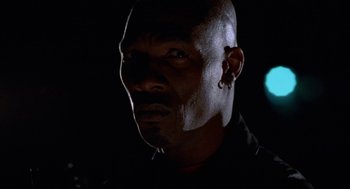 Movie still from “The Players Club” (1998), directed by Ice Cube – A person wearing a black shirt; Close Up shot, Low angle