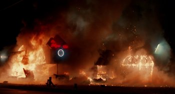 Movie still from “The Players Club” (1998), directed by Ice Cube – A red and white sign and some smoke in the background; Extreme Wide shot, Low angle