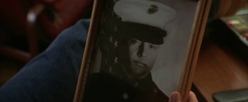 Movie still from “The Pledge” (2001), directed by Sean Penn – An old picture of a man in a military uniform; Extreme Close Up shot, Low angle