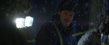 Movie still from “The Pledge” (2001), directed by Sean Penn – A man wearing a hat and a jacket in the snow; Close Up shot, Low angle