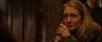 Movie still from “The Pledge” (2001), directed by Sean Penn – A person with her hand on her chin; Close Up shot, High angle