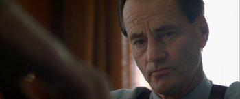 Movie still from “The Pledge” (2001), directed by Sean Penn – A man's face as he stares at the camera; Close Up shot, Over the shoulder angle