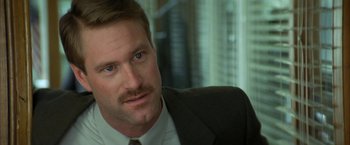 Movie still from “The Pledge” (2001), directed by Sean Penn – A person wearing a suit and tie; Close Up shot, Low angle