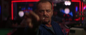 Movie still from “The Pledge” (2001), directed by Sean Penn – An older man is smoking a cigarette in a bar; Close Up shot, Low angle