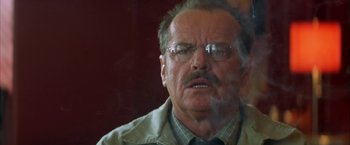 Movie still from “The Pledge” (2001), directed by Sean Penn – An older man with glasses and a mustache; Close Up shot, Low angle