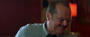 Movie still from “The Pledge” (2001), directed by Sean Penn – An older man wearing glasses and a plaid shirt; Close Up shot, Over the shoulder angle