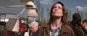 Movie still from “The Pledge” (2001), directed by Sean Penn – A man and a woman standing next to each other; Close Up shot, Low angle