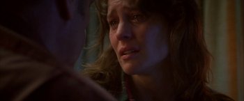 Movie still from “The Pledge” (2001), directed by Sean Penn – A person with a crying face; Close Up shot, Over the shoulder angle