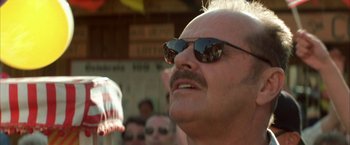 Movie still from “The Pledge” (2001), directed by Sean Penn – A person wearing sunglasses; Close Up shot, Low angle