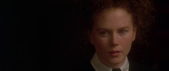 Movie still from “The Portrait of a Lady” (1996), directed by Jane Campion – A person wearing a suit and tie; Close Up shot, Low angle