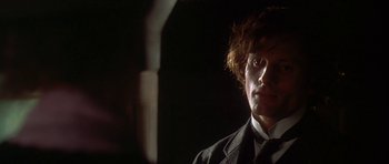 Movie still from “The Portrait of a Lady” (1996), directed by Jane Campion – A person wearing a suit and tie; Close Up shot, Low angle