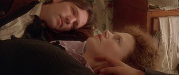 Movie still from “The Portrait of a Lady” (1996), directed by Jane Campion – A man and a woman laying on a bed; Close Up shot, Overhead angle
