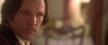 Movie still from “The Portrait of a Lady” (1996), directed by Jane Campion – A person with a mustache; Close Up shot, Over the shoulder angle