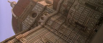 Movie still from “The Portrait of a Lady” (1996), directed by Jane Campion – View of a building with many arches; Extreme Wide shot, Overhead angle