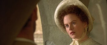Movie still from “The Portrait of a Lady” (1996), directed by Jane Campion – A person wearing a hat; Close Up shot, Over the shoulder angle