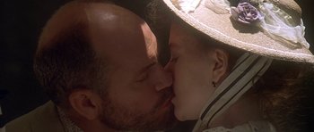 Movie still from “The Portrait of a Lady” (1996), directed by Jane Campion – A man and a woman kissing each other; Close Up shot, Low angle