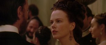 Movie still from “The Portrait of a Lady” (1996), directed by Jane Campion – A person wearing a tiara; Close Up shot, Over the shoulder angle