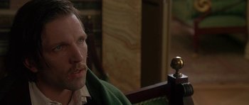 Movie still from “The Portrait of a Lady” (1996), directed by Jane Campion – A person sitting in front of a camera; Close Up shot, Over the shoulder angle