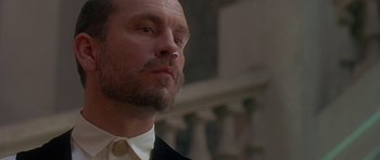 Movie still from “The Portrait of a Lady” (1996), directed by Jane Campion – A person wearing a suit and tie; Close Up shot, Low angle