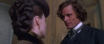 Movie still from “The Portrait of a Lady” (1996), directed by Jane Campion – A man and a woman looking at one another; Close Up shot, Over the shoulder angle