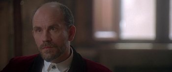 Movie still from “The Portrait of a Lady” (1996), directed by Jane Campion – A person wearing a suit and tie; Close Up shot, Over the shoulder angle