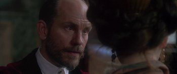 Movie still from “The Portrait of a Lady” (1996), directed by Jane Campion – A person with a beard and mustache; Close Up shot, Over the shoulder angle