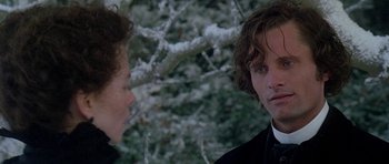Movie still from “The Portrait of a Lady” (1996), directed by Jane Campion – Two people standing next to each other in front of a snowy tree; Close Up shot, Over the shoulder angle