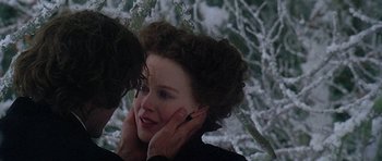 Movie still from “The Portrait of a Lady” (1996), directed by Jane Campion – A young woman with her hands on her face; Close Up shot, Over the shoulder angle