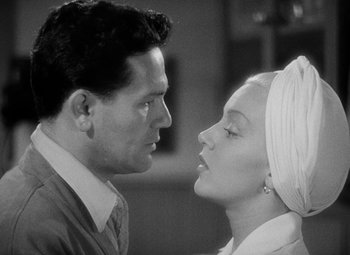 Movie still from “The Postman Always Rings Twice” (1946), directed by Tay Garnett – A man and a woman face to face in a black and white photo; Close Up shot, Low angle
