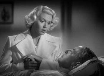 Movie still from “The Postman Always Rings Twice” (1946), directed by Tay Garnett – An old black and white photo of a man and a woman; Close Up shot, Low angle