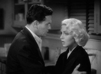 Movie still from “The Postman Always Rings Twice” (1946), directed by Tay Garnett – A man and a woman standing next to each other; Close Up shot, Over the shoulder angle