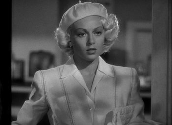 Movie still from “The Postman Always Rings Twice” (1946), directed by Tay Garnett – A black - and - white photo of a woman wearing a hat; Close Up shot, Over the shoulder angle