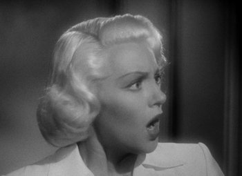 Movie still from “The Postman Always Rings Twice” (1946), directed by Tay Garnett – A black and white photo of a woman with blonde hair; Close Up shot, Over the shoulder angle