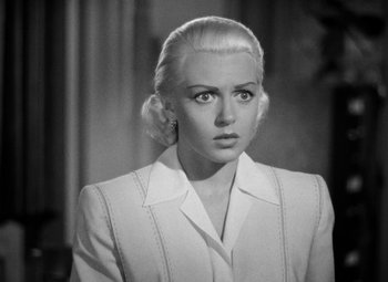Movie still from “The Postman Always Rings Twice” (1946), directed by Tay Garnett – A black - and - white photo of a woman with blonde hair; Close Up shot, High angle