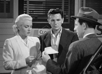 Movie still from “The Postman Always Rings Twice” (1946), directed by Tay Garnett – Two men and a woman standing in front of each other; Medium shot, High angle