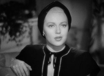 Movie still from “The Postman Always Rings Twice” (1946), directed by Tay Garnett – A black and white photo of a woman wearing a hat; Close Up shot, High angle