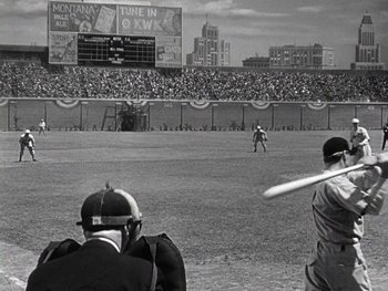 Movie still from “The Pride of the Yankees” (1942), directed by Sam Wood – A black and white photo of a baseball game in progress; Extreme Wide shot, Over the shoulder angle