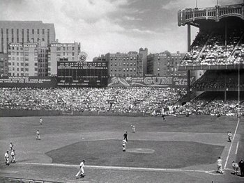 Movie still from “The Pride of the Yankees” (1942), directed by Sam Wood – A black and white photo of a baseball game in progress; Extreme Wide shot, High angle
