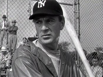 Movie still from “The Pride of the Yankees” (1942), directed by Sam Wood – A black and white photo of a man in a baseball uniform; Close Up shot, Low angle