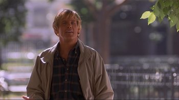 Movie still from “The Prince of Tides” (1991), directed by Barbra Streisand – A person standing near a tree; Medium shot, Low angle