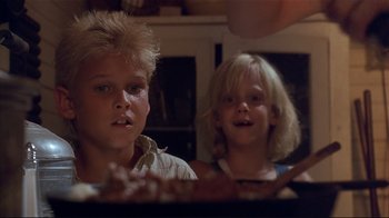 Movie still from “The Prince of Tides” (1991), directed by Barbra Streisand – Two young children are looking at the camera; Close Up shot, Low angle