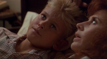 Movie still from “The Prince of Tides” (1991), directed by Barbra Streisand – A boy and a woman laying on a bed; Close Up shot, Low angle
