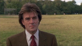 Movie still from “The Prince of Tides” (1991), directed by Barbra Streisand – A person wearing a suit and tie; Close Up shot, Low angle