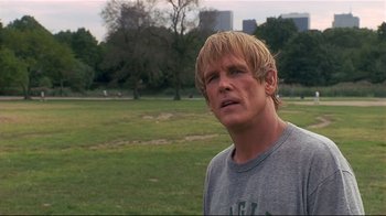 Movie still from “The Prince of Tides” (1991), directed by Barbra Streisand – A person in a field with trees in the background; Close Up shot, Over the shoulder angle