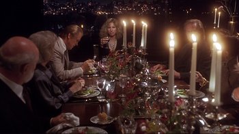 Movie still from “The Prince of Tides” (1991), directed by Barbra Streisand – A group of people sitting around a dinner table; Wide shot, High angle